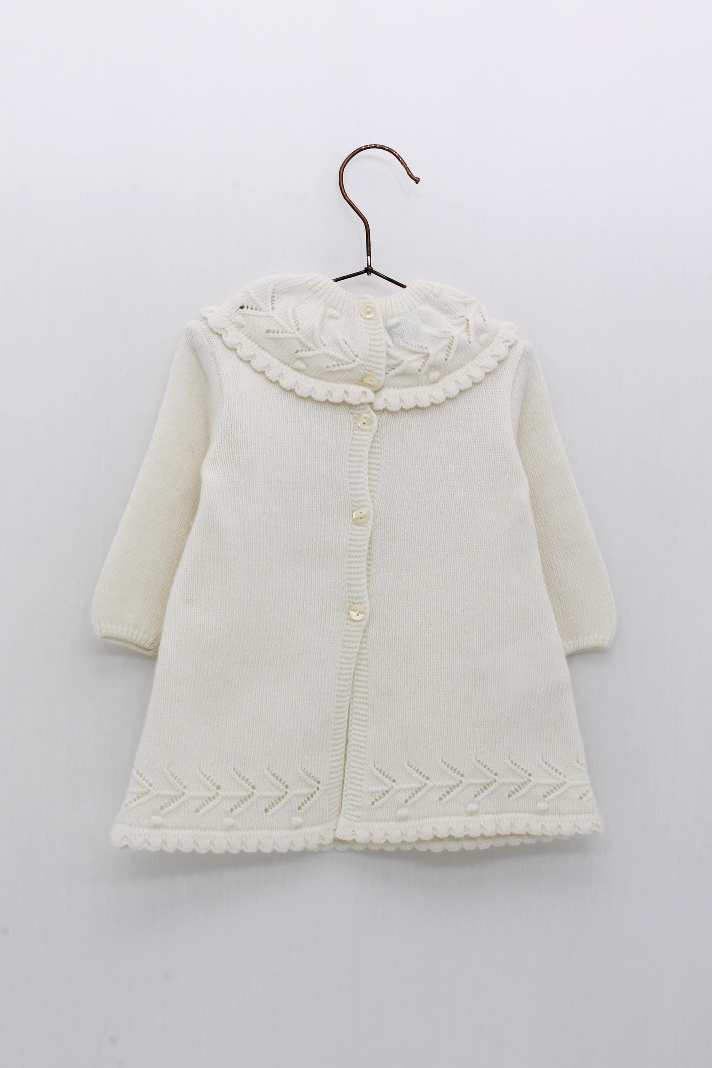 Knitted christening dress