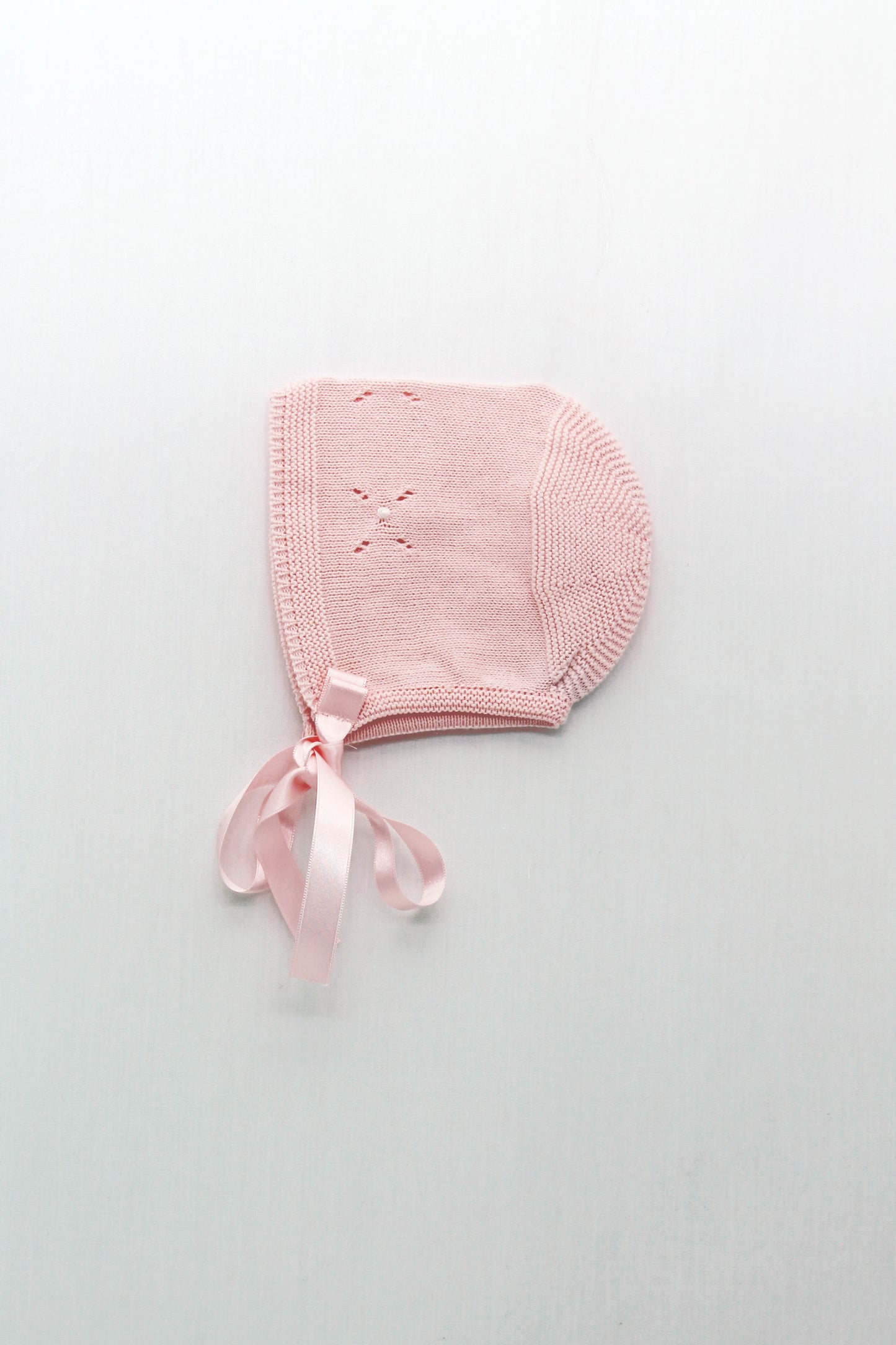 Knitted hood with openwork