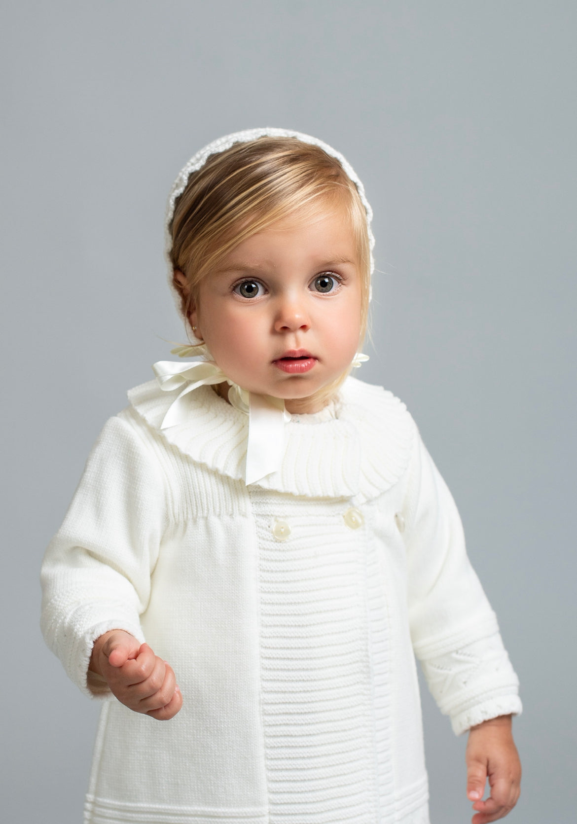 Knitted christening dress