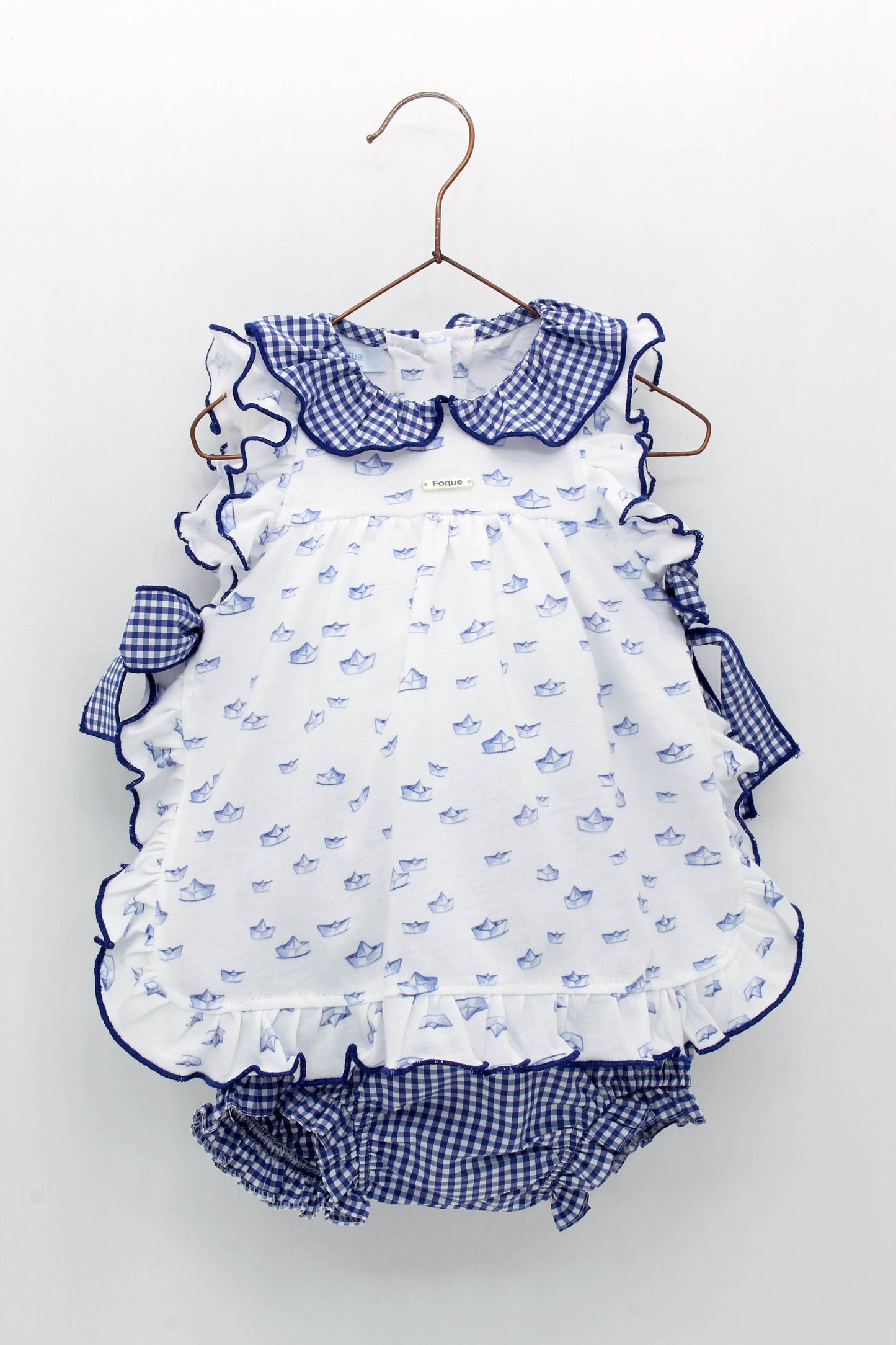 Paper boat print dress with ruffled collar and gingham bows