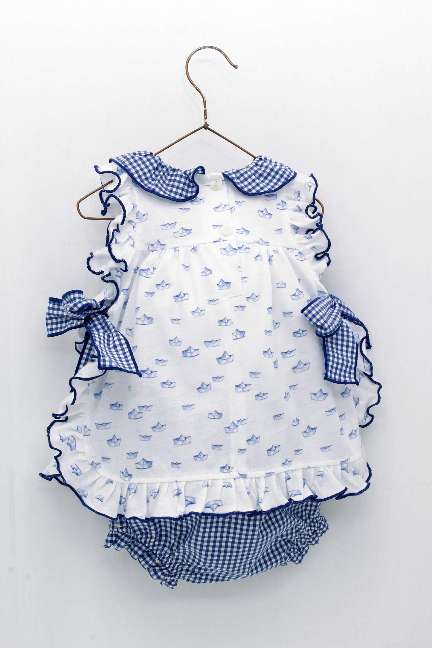 Paper boat print dress with ruffled collar and gingham bows