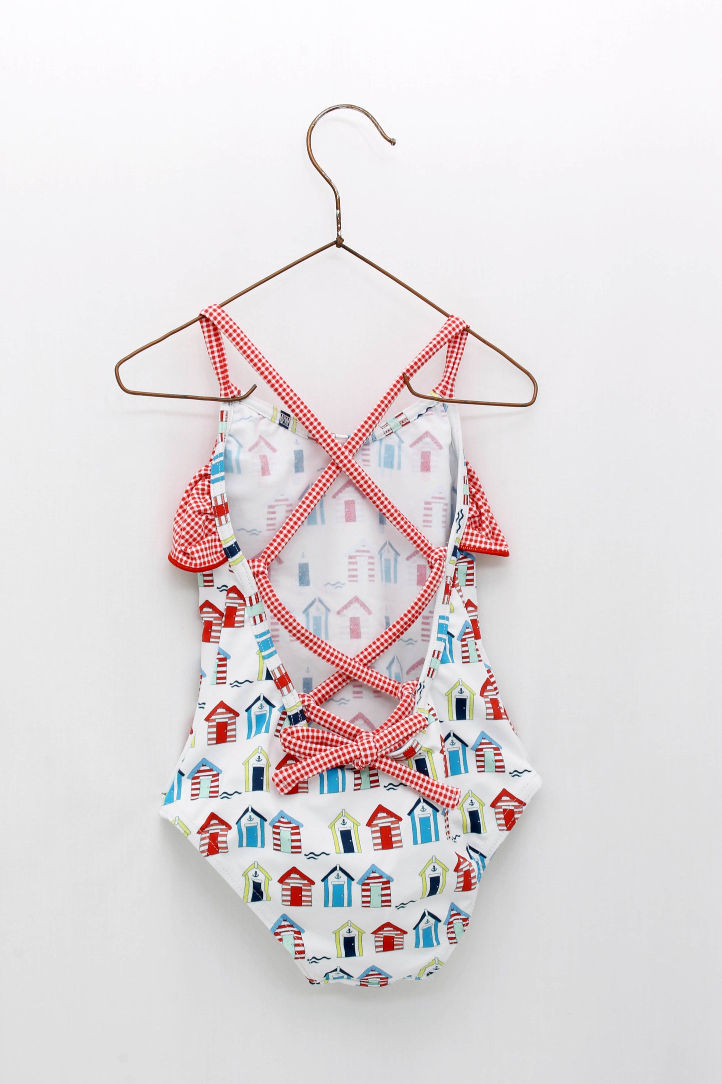 Bañador estampado casetas con tiras cruzadas en espalda y volantes en vichy