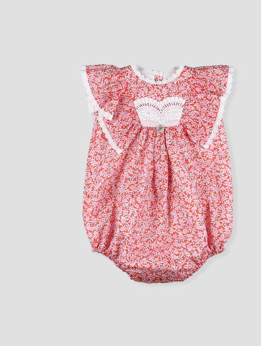 Pelele bebé niña estampado floral coral con encaje