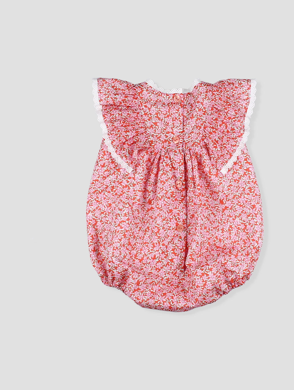 Pelele bebé niña estampado floral coral con encaje