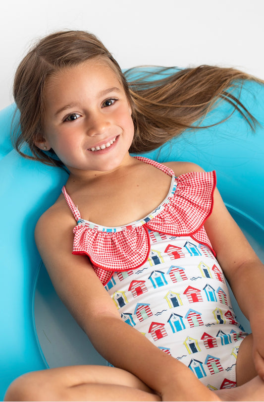 Swimsuit with shed print and crossed straps on the back and gingham flounces
