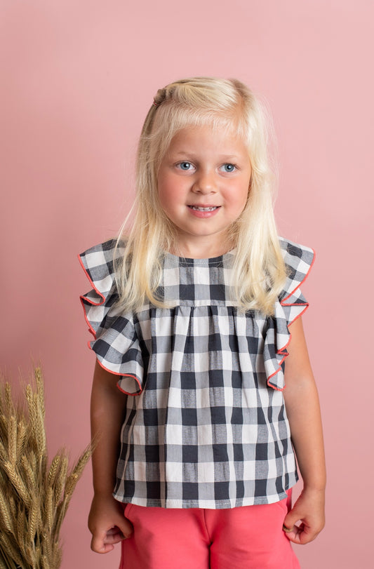 Girl's blouse set with large gingham checks and ruffle sleeves and plush shorts